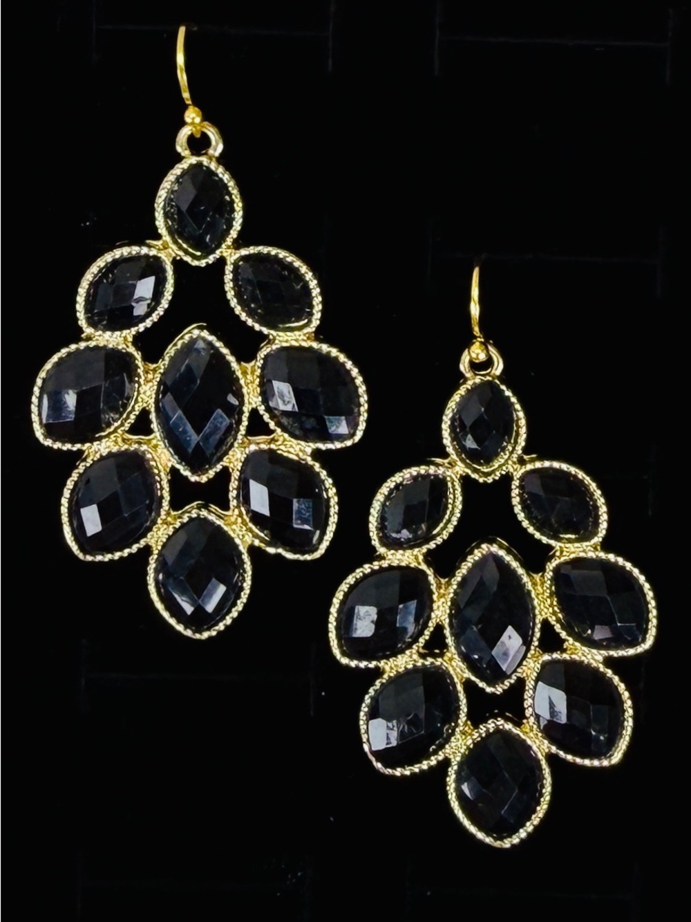 Goldtone and black reflective costume pierced earrings